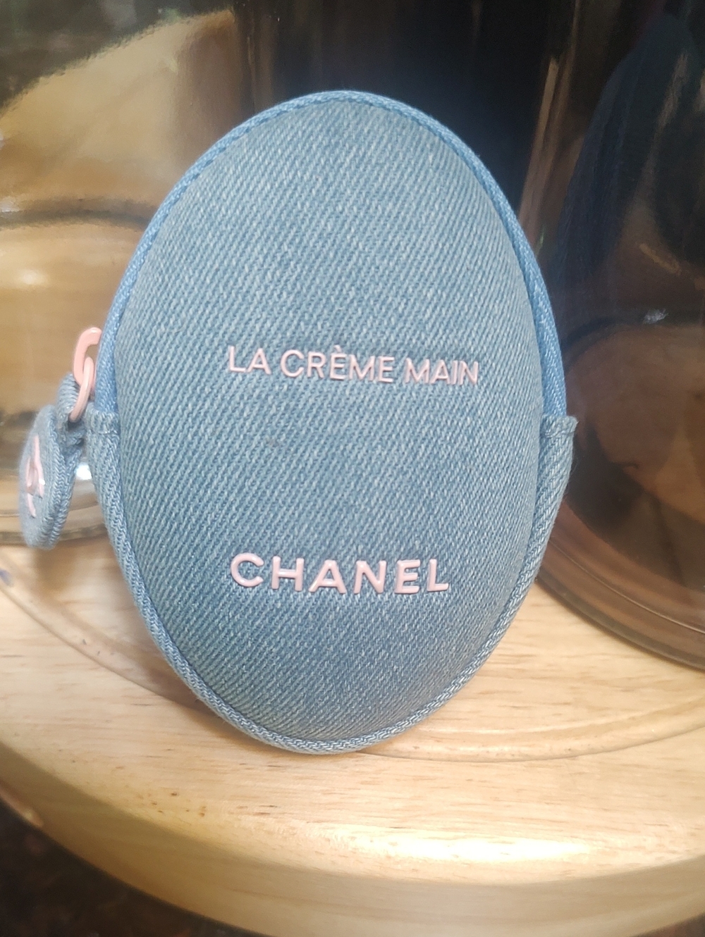 CHANEL Denim La Crème Main Pouch in Light Blue with Pink Logo